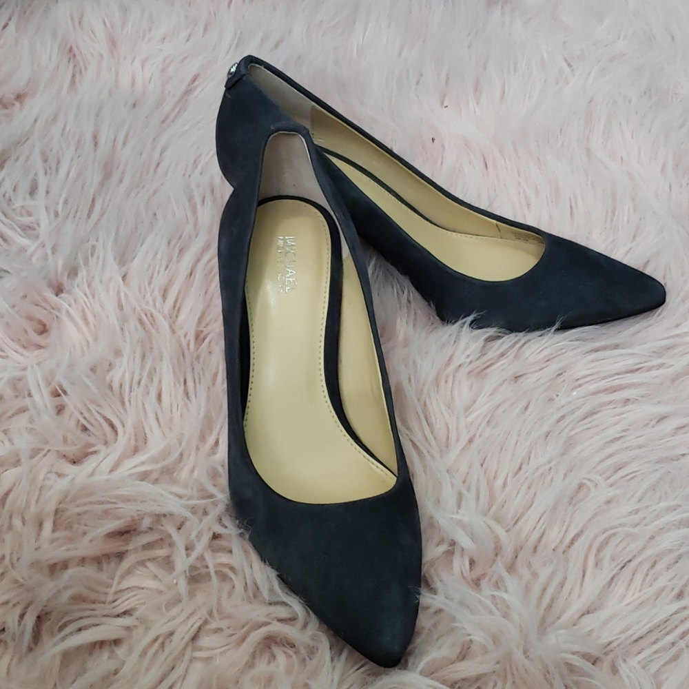 A pair of Michael Kors in dark blue suede